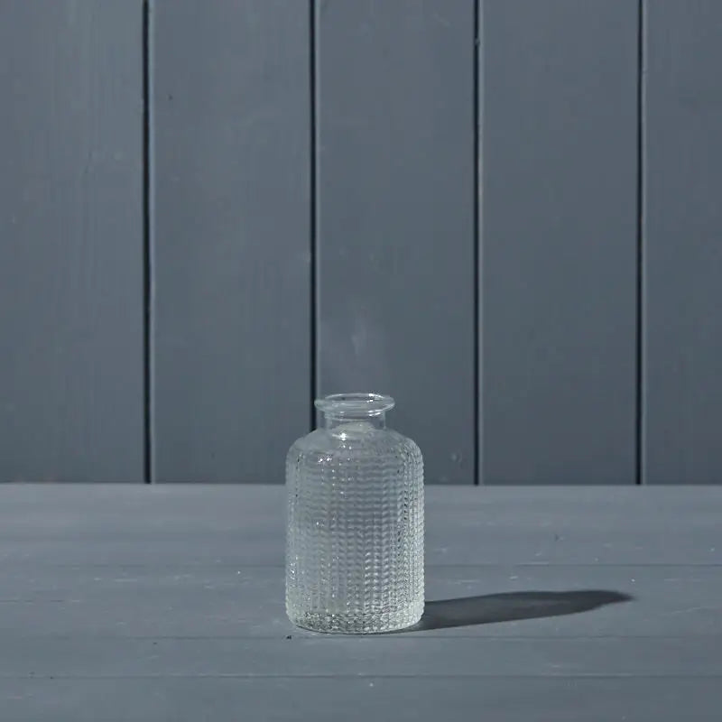 Klar glassflaske med struktur